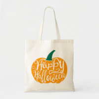 Happy Halloween lettering on carved pumpkin