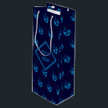 HAPPY HANUKKAH חנוכה שמח Hebrew Dreidel NAVY CYAN Wine Gift Bag<br><div class="desc">This stylish midnight blue WINE gift bag with all over cyan dreidel print would make an excellent choice for presenting your bottle gifts during Hanukkah. The front says חנוכה שמח (Happy Hanukkah) and the back shows customizable placeholder text. Matching gifts and home decor ideas are available in the HANUKKAH Collection...</div>