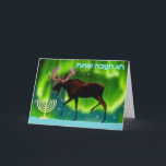 Happy Hanukkah - Northern Lights Moose Holiday Card<br><div class="desc">Chanukkah greetings from the Frozen Chosen. A Chanukkah menorah and an ever so slightly stylized image of a moose silhouetted against the Northern Lights.  Hebrew text reading,  "חנוכה שמח חג" (Chag Chanukkah Sameach - Happy Hanukkah) appears in in glowing blue and white.</div>