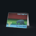 Happy Hanukkah - Polar Lights Polar Bear Holiday Card<br><div class="desc">Chanukkah greetings from the Frozen Chosen. A polar bear roams the ice during the long polar night; the Northern Lights in red and green glow in the distance.A Chanukkah menorah appears along with Hebrew text reading,  "חנוכה שמח חג" (Chag Chanukkah Sameach - Happy Hanukkah). Add your own additional text.</div>