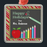 Happy Holidays Chalkboard Teacher Metal Ornament<br><div class="desc">This Christmas tree ornament features a chalkboard,  a red apple and colour pencils. The text on the chalkboard reads: Happy Holidays. Customizable text allows you to add "to or from" and a personal name.</div>