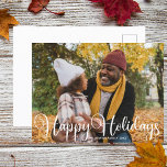 Happy Holidays Family Photo Modern Minimalist Chic Postcard<br><div class="desc">Elegant Happy Holidays photo postcard with beautiful white cursive typography. This modern,  minimalist holiday family photograph postcard features gorgeous script and your name in white over the full bleed picture.</div>