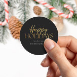 Happy Holidays Modern Black Gold Script Business Classic Round Sticker<br><div class="desc">Custom Christmas stickers featuring Happy Holidays in elegant gold typography on black colour background.</div>
