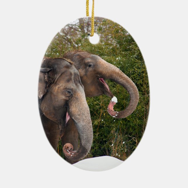 Happy smiling cute elephants playing in the snow. ceramic ornament (Back)