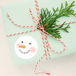 Happy Winter Snowman Face Classic Round Sticker<br><div class="desc">Your friends and family will smile this winter season with these cute custom snowman stickers. Design features a jolly snowman with warm rosy cheeks,  a carrot nose and smile made of coal. Snow white,  black,  pink and orange design colors.</div>