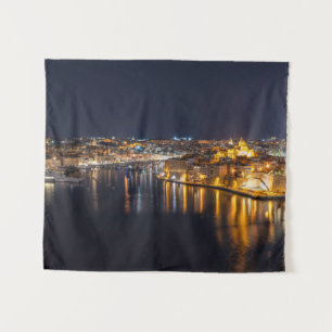 Harbor in Malta illuminated at night Tapestry