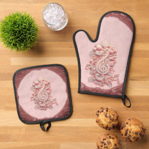 Harmony in pink, a majestic, stylized treble clef. oven mitt & pot holder set