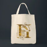 Harry Potter | Aguamenti HUFFLEPUFF™ Graphic Tote Bag<br><div class="desc">Check out this Hufflepuff graphic based on the Aguamenti water-making spell. This features a yellow badger poking it's head through a giant letter "H" and the name "Hufflepuff" written below.</div>