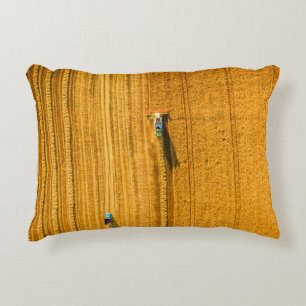 Harvester machine working in field. Combine harves Accent Pillow