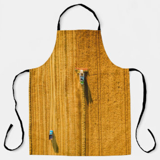 Harvester machine working in field. Combine harves Apron