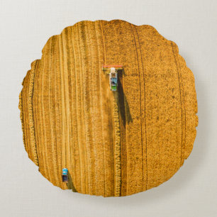 Harvester machine working in field. Combine harves Round Pillow