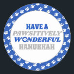 Have a Pawsitively Wonderful Hanukkah Classic Round Sticker<br><div class="desc">Introducing our delightful Hanukkah design featuring a charming border of white paw prints on a blue background. Embrace the festive spirit of Hanukkah with this design, which encloses a clean white background showcasing the heartfelt text "Have a pawsitively wonderful Hanukkah." The text is presented in blue and silver colours, with...</div>