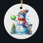 Have the Merriest Christmas by Par | Disc Golf Ceramic Ornament<br><div class="desc">Have the merriest Christmas by par. Disc golf themed art. Cute watercolor cartoon snowman in Santa hat next to a disc golf basket in the snow next to a Christmas tree.</div>