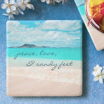 Hawaii Tropical Beach Peace Love Sandy Feet Script Stone Coaster<br><div class="desc">“Peace, love & sandy feet.” Relax with your favourite beverage on this stunning pastel-coloured photo stone coaster, all while you remind yourself of the fresh salt smell of the ocean air. Exhale and explore the solitude of an empty Hawaiian beach. Makes a great housewarming gift! You can easily personalize this...</div>