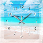 Hawaii turquoise blue ocean and sandy beach photo square wall clock<br><div class="desc">Remind yourself of the fresh salt smell of the ocean air whenever you check the time on this stunning, vibrantly-coloured photo wall clock. Exhale and explore the solitude of an empty Hawaiian beach. Your choice of a round or square clock face. Makes a great housewarming gift! You can easily personalize...</div>