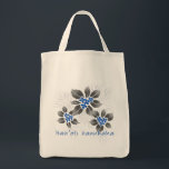 Hawaiian Holly Hanukkah Blue Floral Tote Bag<br><div class="desc">Hau’oli Hanukaha is Hawai'ian for Happy Hanukkah! This illustration showcases a tropical interpretation of holly in Hanukkah colors and subtle gradients. The lettering is dusted with snow for an added surprise. For that special chef in your life,  this original illustration is shown here on the cotton grocery tote.</div>