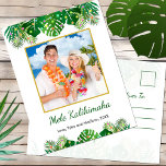 Hawaiian Mele Kalikimaka Christmas Lights Photo Holiday Postcard<br><div class="desc">This fun, modern holiday postcard design features lush tropical beach foliage on the front, including palm fronds and monstera philodendron leaves, decorated with glowing multicolored lights, at the top and bottom. In the middle is a customizable gold-edged square photo that you can replace with your own. Below the photo are...</div>