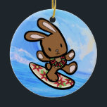 Hawaiian Surfing Bunny Holiday Cartoon Ceramic Ornament<br><div class="desc">There is nothing better than a tropical vacation during the winter holidays! And even better, our adorable surfing bunny, Coco takes on the big waves on the North Shore of Oahu, Hawaii. He brings with him the Aloha sprit for the holidays and wishes you a "Mele Kalikimaka" (Merry Christmas). This...</div>