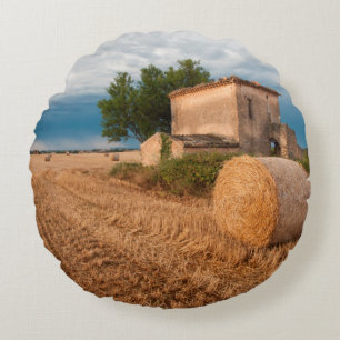 Hay bale in Provence field Round Pillow