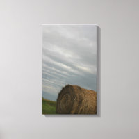 Haystack with storm clouds overhead farm photo