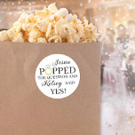 He Popped the Question Diamond Ring Popcorn Favour Classic Round Sticker<br><div class="desc">He popped the question stickers for your popcorn favours at your engagement party or bridal shower you can personalize by writing the groom-to-be's name and the bride-to-be's name for a more customized touch. The O in Popped is replaced with a diamond engagement ring. Works equally well for champagne favours!</div>