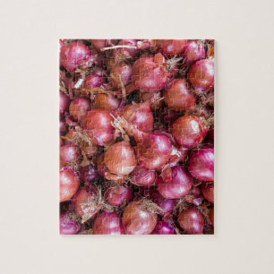 Heap of red onions on market jigsaw puzzle