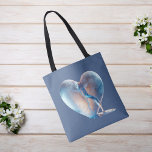 Heart Broken Blue Tote Bag<br><div class="desc">This stunning design features a heart that resembles translucent glass, delicately cracked halfway through, with crystal-clear water flowing gracefully from within. Set against a serene blue background, this unique digital artwork adds a contemporary and ethereal touch to any space.</div>