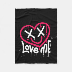 heart character with dead eyes and smile sprayed fleece blanket