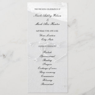 Heart drawn in beach sand wedding ceremony program