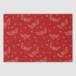 Hearts and wings on red tissue paper