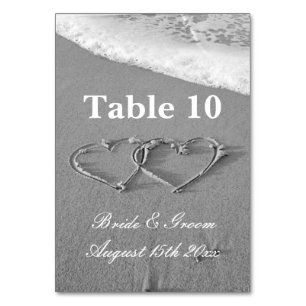 Hearts in sand drawing beach photo wedding table number