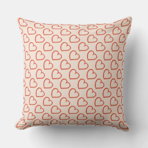 Hearts pattern red on pink throw pillow