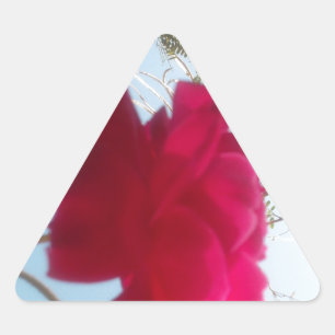 Heavenly Bloom: A Rose Against the Sky Triangle Sticker