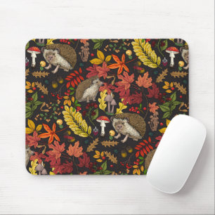 Hedgehogs and autumn forest flora on black mouse pad