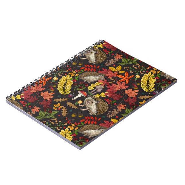 Hedgehogs and autumn forest flora on black notebook (Left Side)