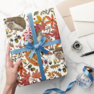 Hedgehogs and autumn forest flora on ivory wrapping paper
