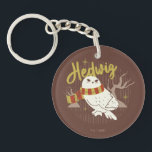 Hedwig Whimsical Forest Drawing Keychain<br><div class="desc">Show your house spirit in the coziest way with this charming Hedwig™ design. Featuring the beloved snowy owl bundled up in a warm Gryffindor house-colored scarf, this playful illustration captures the magic and loyalty of Harry Potter’s trusted companion. Set against a whimsical woodland backdrop with subtle sparkling accents, the hand-drawn...</div>