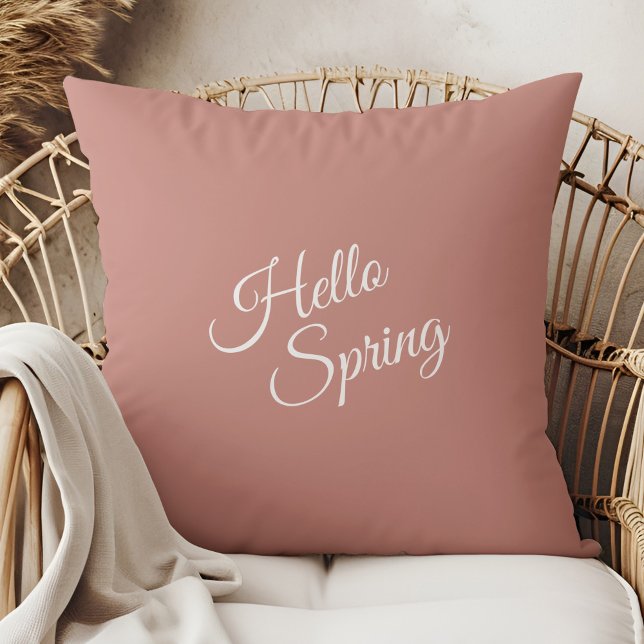 Hello Spring Dusty Rose Throw Pillow (Hello Spring Dusty Rose Throw Pillow in a boho rattan armchair.)