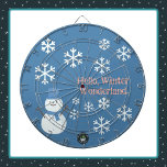 Hello, Winter Wonderland Dartboard<br><div class="desc">A Slice of Life and Delight presents a Winter Wonderland dartboard featuring a snowman decorated with white snowflakes, pink writing, and a blue backdrop. The snowman dart board also features a blue hat and scarf.</div>