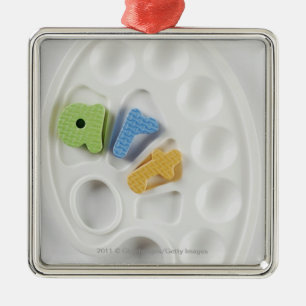 High angle view of alphabets on a palette metal ornament