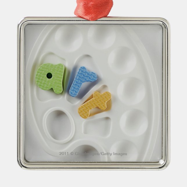 High angle view of alphabets on a palette metal ornament (Front)