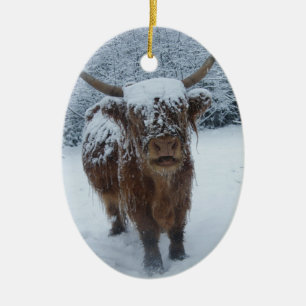 Highland cow in the snow ceramic ornament