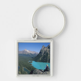 Hiker overlooking turquoise-coloured Lake Keychain