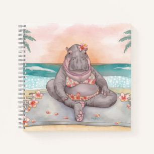 Hippo in bikini is on the beach relaxing notebook