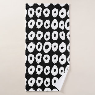 Hipster style pattern with doughnut like shapes in bath towel