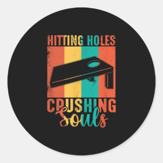 Hitting holes and Crushing Souls Cornhole Classic Round Sticker