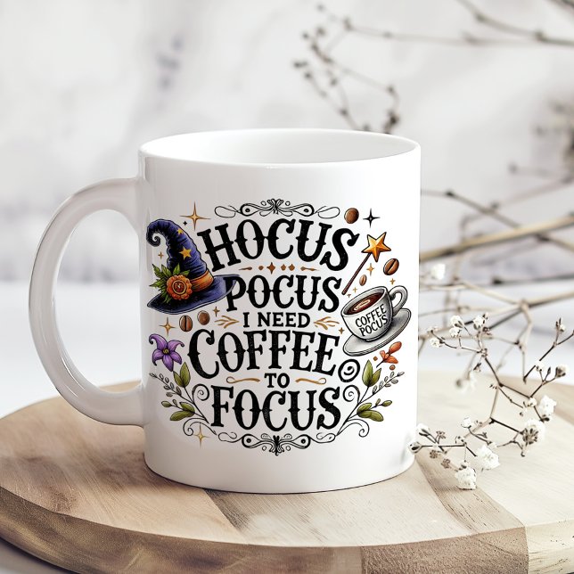 "Hocus Pocus I Need Coffee to Focus" Large Coffee Mug ("Hocus Pocus I Need Coffee" Funny Witchy Giant Coffee Mug on a kitchen table with tiny dry flowers)