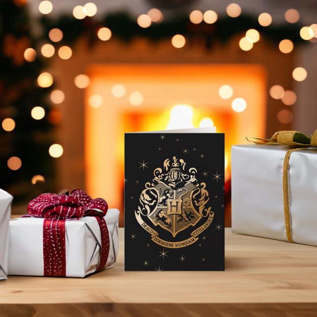 HOGWARTS™ Glistening Golden Crest Holiday Card (Card on table)