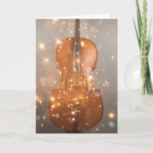 Holiday card with magical cello with snow & light