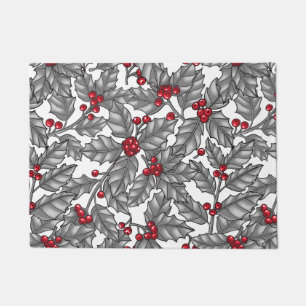 Holly berry, grey leaves on white doormat